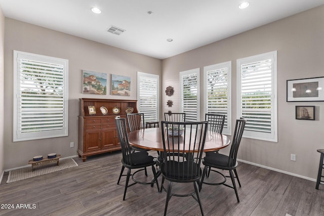 dining space with dark hardwood / wood-style floors and a wealth of natural light