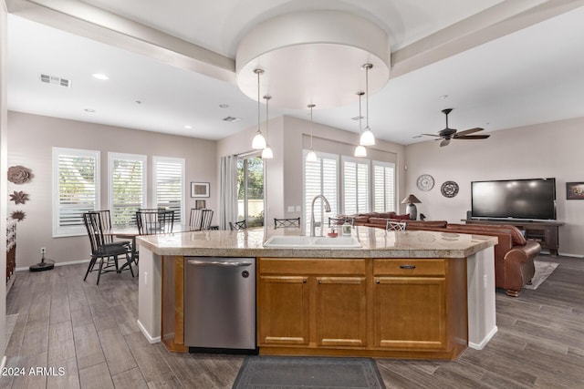 kitchen featuring ceiling fan, dishwasher, sink, hanging light fixtures, and dark wood-type flooring