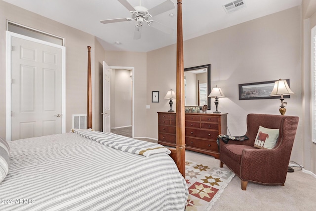 bedroom featuring ceiling fan and light carpet