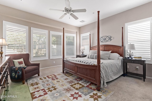 bedroom featuring light carpet and ceiling fan