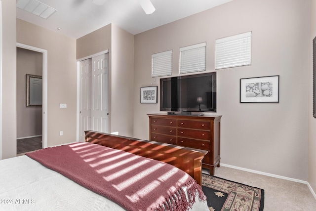 bedroom with carpet flooring, a closet, and ceiling fan