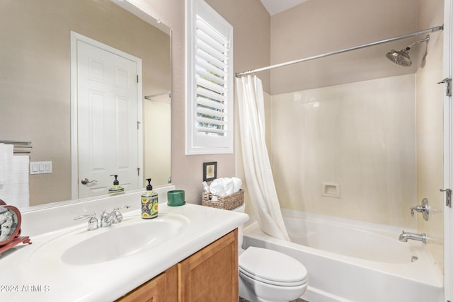 full bathroom featuring vanity, shower / bath combination with curtain, and toilet