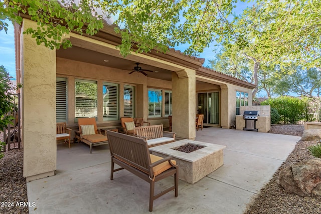 view of patio with grilling area, ceiling fan, and an outdoor living space with a fire pit