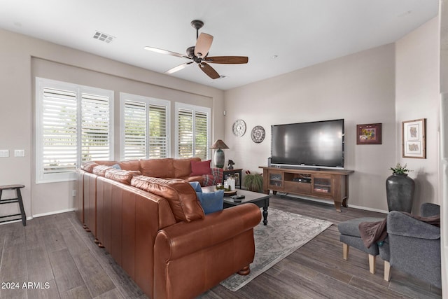 living room with ceiling fan and dark hardwood / wood-style flooring