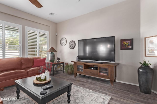 living room featuring dark hardwood / wood-style floors and ceiling fan