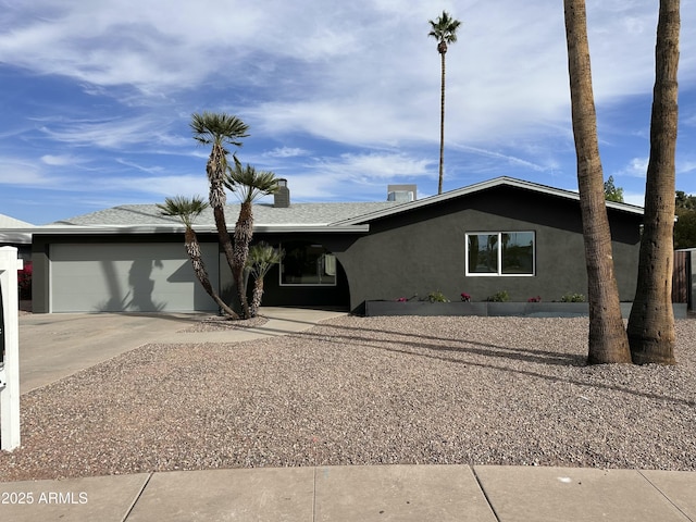 ranch-style home with a garage