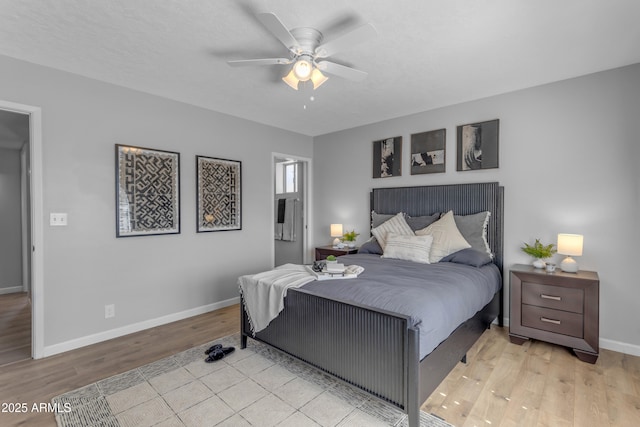 bedroom with light wood-type flooring, baseboards, and a ceiling fan