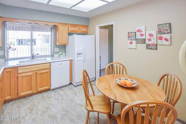 kitchen with sink and white appliances