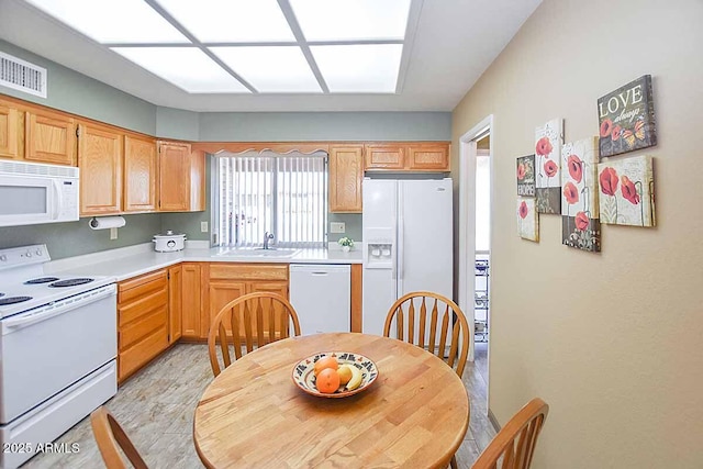 kitchen with sink and white appliances