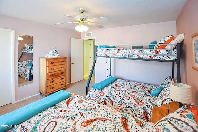 bedroom featuring ceiling fan and light carpet