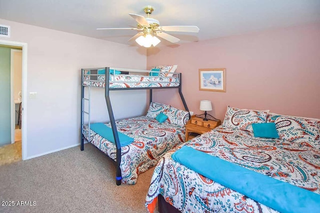 bedroom featuring ceiling fan and carpet