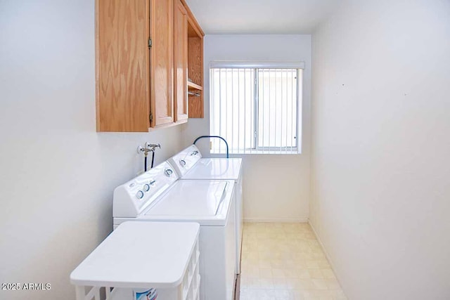 laundry room featuring cabinets and independent washer and dryer