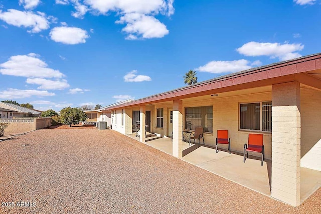 back of house with a patio area and central air condition unit