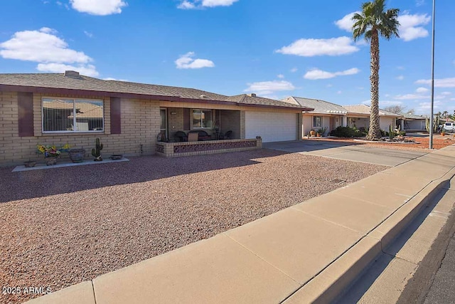 ranch-style home featuring a garage