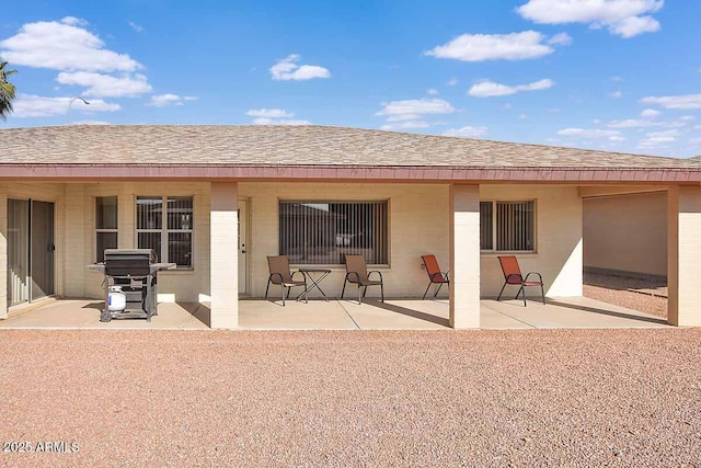 back of property with a patio area