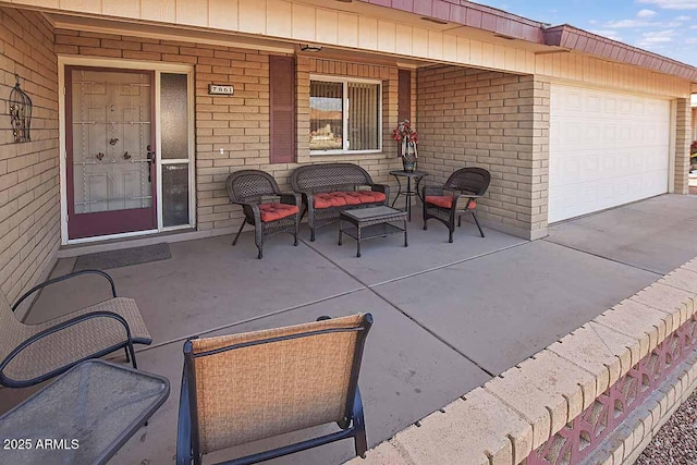 view of patio / terrace featuring a garage