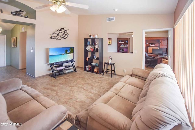 living room with ceiling fan and vaulted ceiling