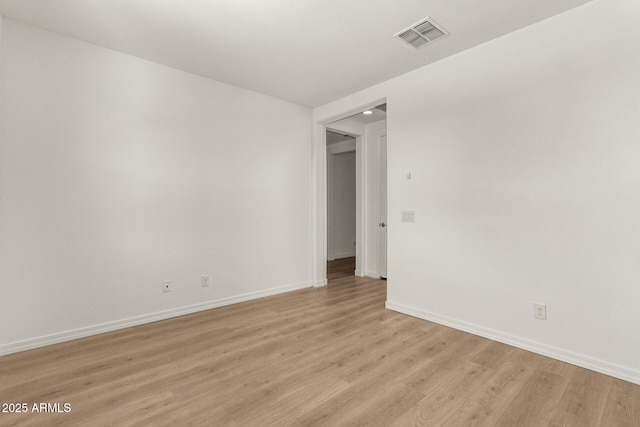 empty room featuring light hardwood / wood-style floors