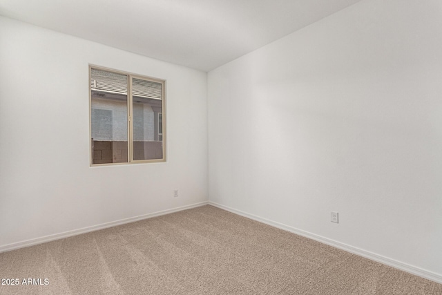 spare room with carpet flooring