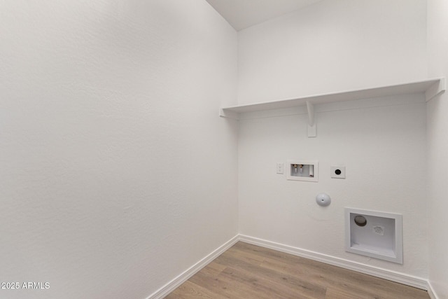 laundry area featuring washer hookup, hookup for a gas dryer, electric dryer hookup, and hardwood / wood-style flooring