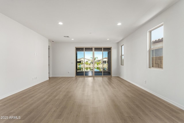 empty room featuring hardwood / wood-style flooring