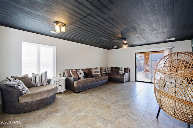 living room with light tile patterned floors and wood ceiling