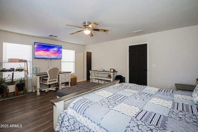 bedroom with ceiling fan and dark hardwood / wood-style flooring