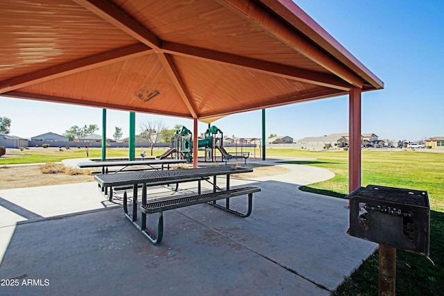 view of home's community with a yard and a playground