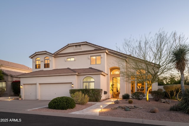 mediterranean / spanish-style home featuring a garage