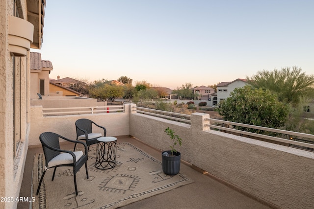 view of balcony at dusk