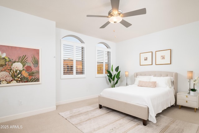 bedroom with light colored carpet and ceiling fan