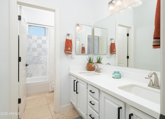 full bathroom featuring tile patterned flooring, vanity, toilet, and shower / bath combo with shower curtain