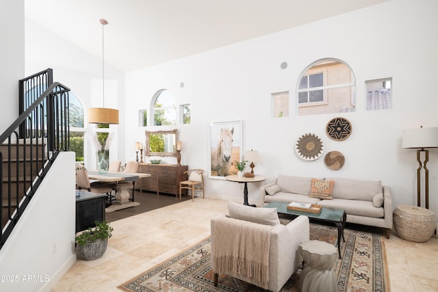 living room featuring high vaulted ceiling