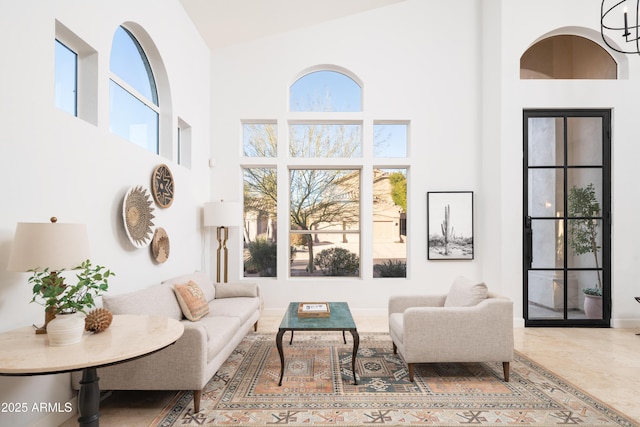 living room featuring a high ceiling