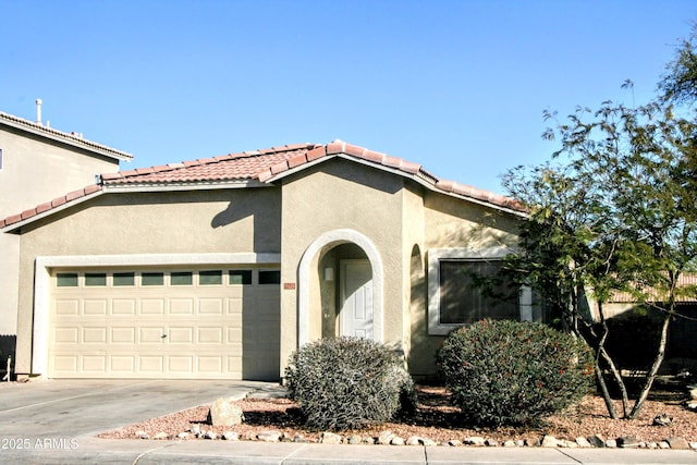 mediterranean / spanish-style house featuring a garage