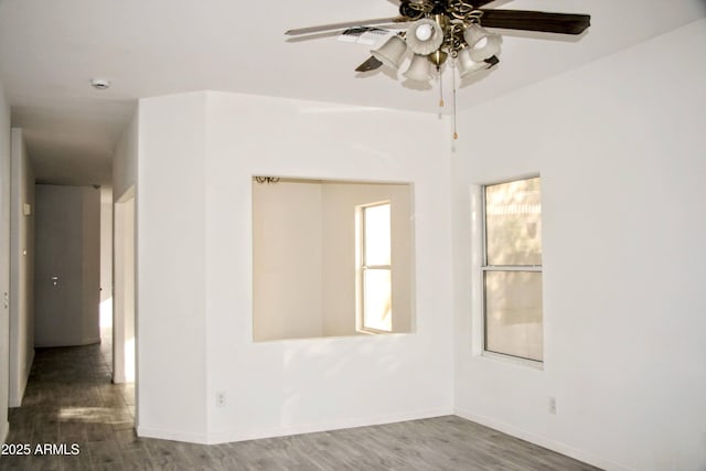 unfurnished room featuring ceiling fan and wood-type flooring