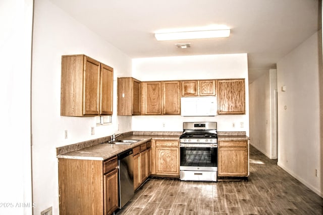 kitchen with sink and appliances with stainless steel finishes