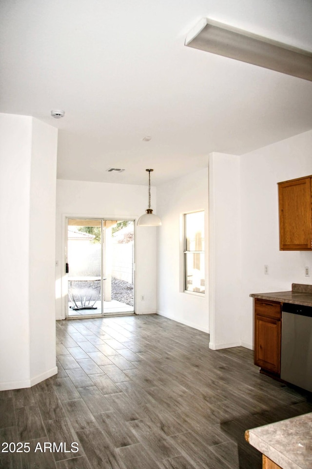 unfurnished living room with dark hardwood / wood-style flooring