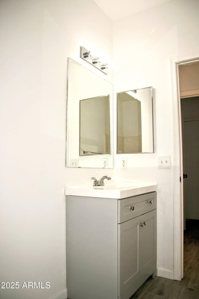 bathroom with vanity and wood-type flooring