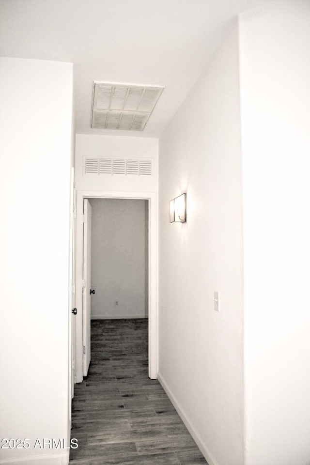 hallway featuring dark hardwood / wood-style floors