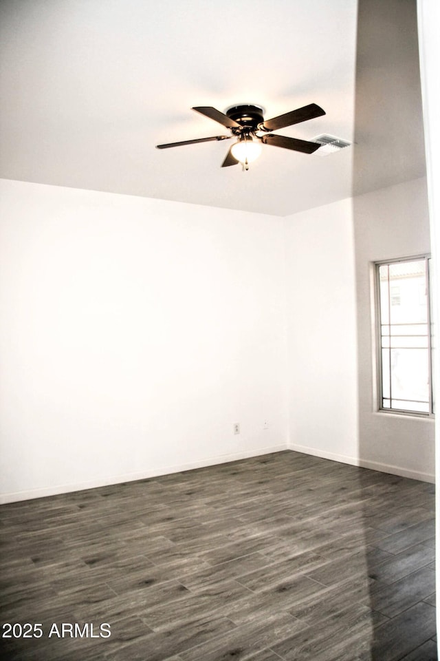 unfurnished room featuring dark hardwood / wood-style flooring and ceiling fan