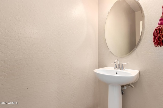 10 N 87th Dr, Tolleson, AZ 85353 - bathroom with a sink and a textured wall
