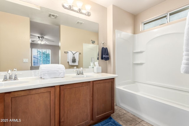 10 N 87th Dr, Tolleson, AZ 85353 - bathroom featuring ceiling fan, double vanity, shower / tub combination, and tile patterned flooring