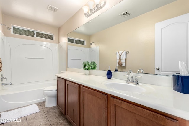 10 N 87th Dr, Tolleson, AZ 85353 - full bathroom featuring vanity, toilet, tile patterned floors, and washtub / shower combination