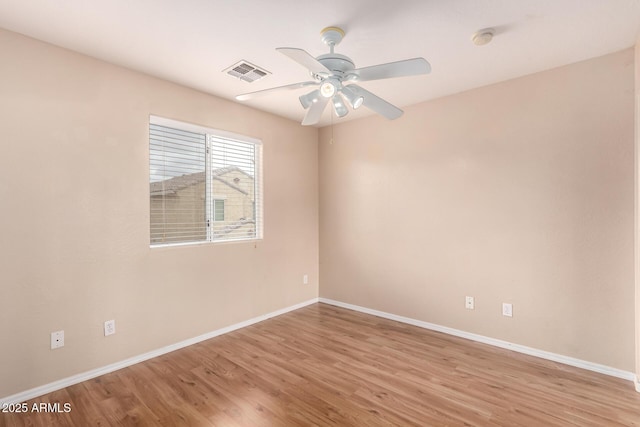 10 N 87th Dr, Tolleson, AZ 85353 - unfurnished room featuring baseboards, ceiling fan, light wood finished floors, and a smoke detector