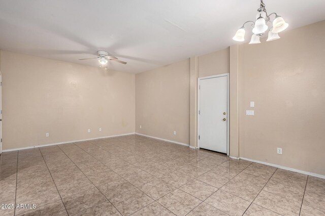10 N 87th Dr, Tolleson, AZ 85353 - unfurnished room with a ceiling fan, a chandelier, light tile patterned floors, and baseboards