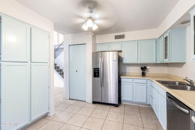 kitchen with visible vents, ceiling fan, light countertops, a sink, and stainless steel appliances