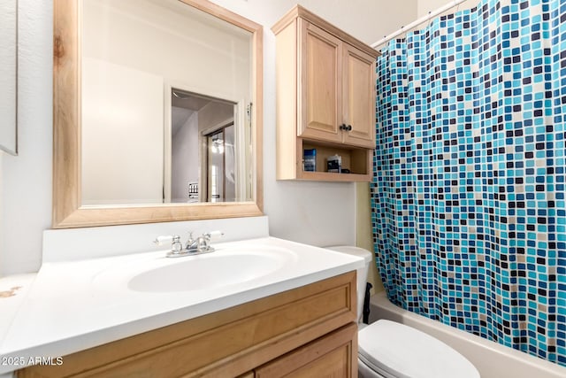 full bathroom with vanity, shower / bathtub combination with curtain, and toilet