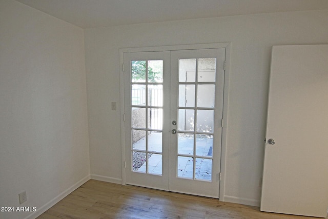 doorway featuring french doors and light hardwood / wood-style floors