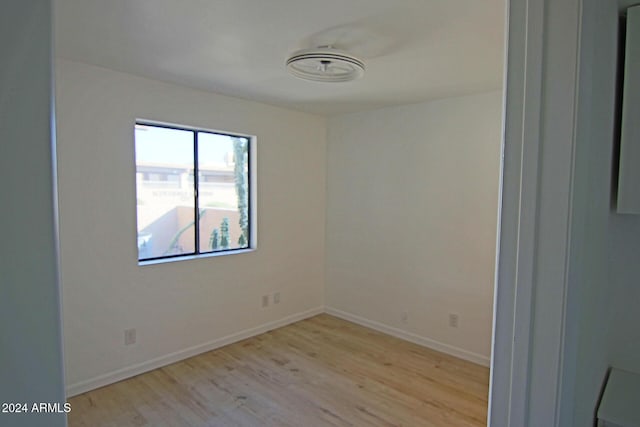 spare room with light hardwood / wood-style flooring